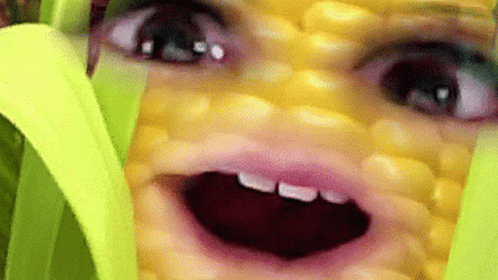 Close Up of Person Face on Corn Cob Mouth Open