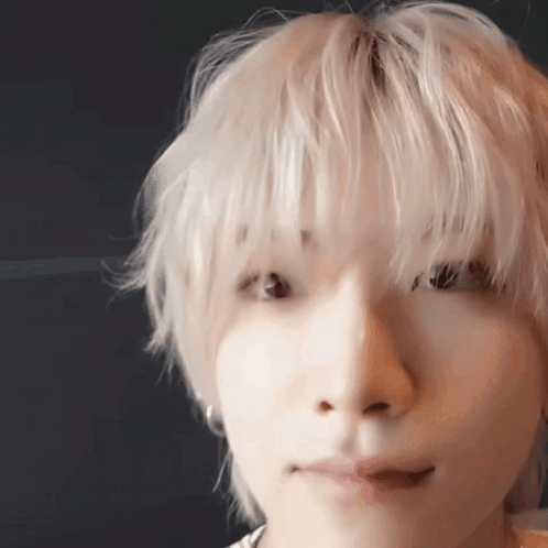 Close Up of Person Face With Blonde Hair and Earrings