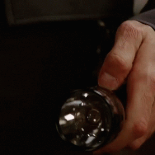 Close Up of Person Holding Flashlight