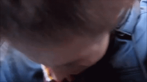 Close Up of Person's Face in Blue Shirt