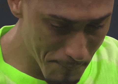 Close Up of Person's Face in Green Shirt