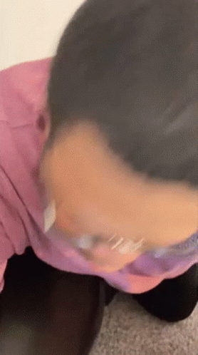 Close Up of Person's Face in Pink Shirt