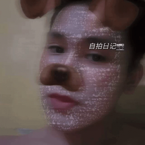 Close Up of Person's Face with Chinese Writing