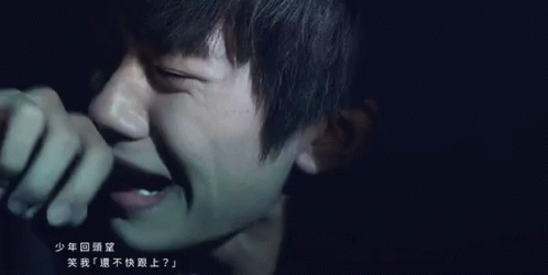 Close Up Of Person's Face With Chinese Writing GIF