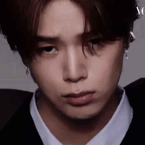 Close Up Of Person's Face With Earrings GIF