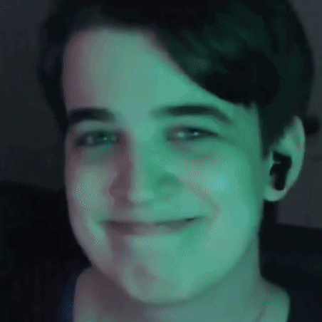 Close Up Of Person's Face With Green Light GIF