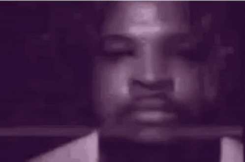 Close Up of Person's Face with Purple Background