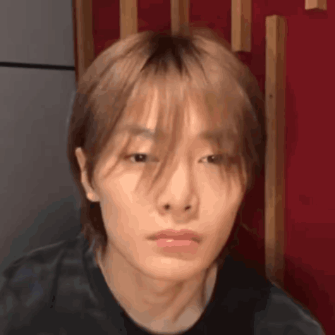 Close Up Of Person's Face With Red Background GIF