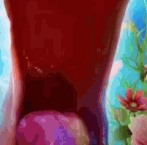 Close Up of Person's Mouth with Purple Object