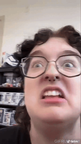 Close Up of Person Wearing Glasses Making Face