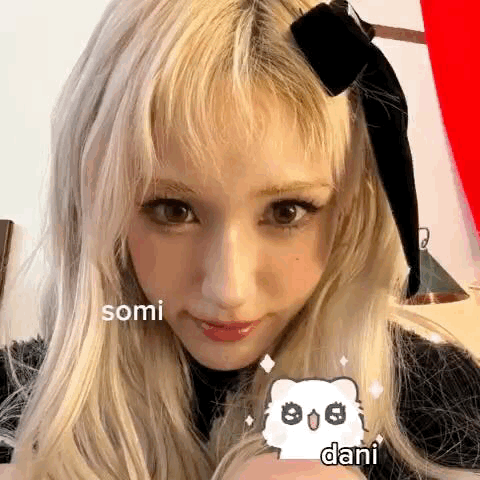 Close Up Of Person With Blonde Hair And Black Bow GIF