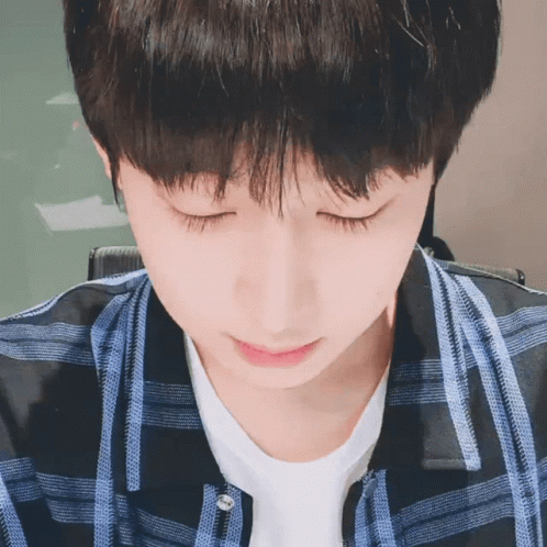Close Up Of Person With Eyes Closed Plaid Shirt GIF