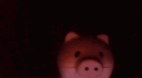 Close Up of Piggy Bank in the Dark