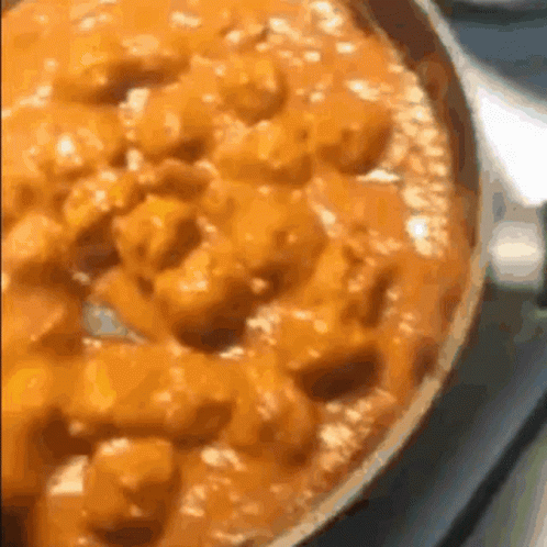Close Up of Pizza in Pan on Stove