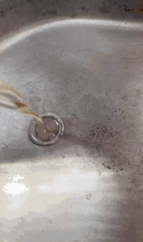 Close Up Of Sink With Drain And Faucet GIF