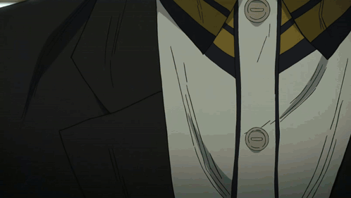 Close Up of Suit and Tie With Letter O Buttons