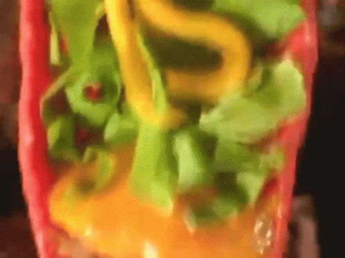 Close Up of Taco With Lettuce and Cheese