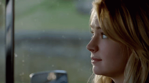 Close Up of Woman Face Looking Out Window