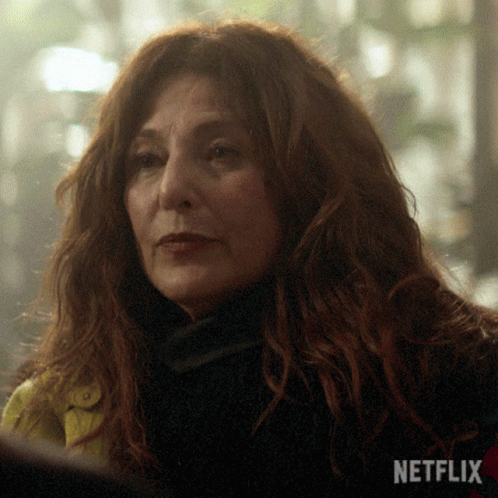 Close Up of Woman Face With Netflix Logo in Background