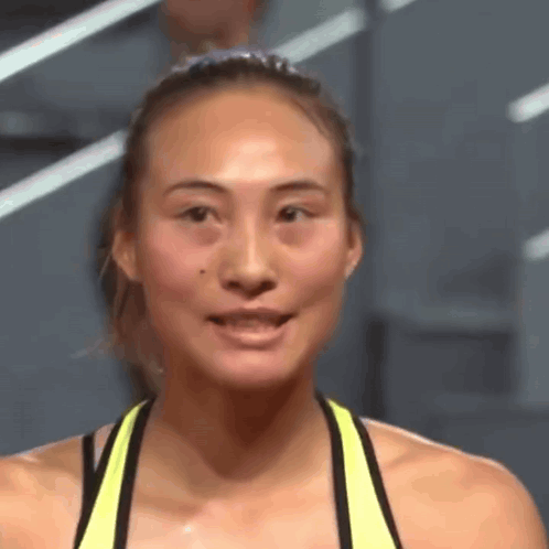 Close Up of Woman in Yellow Tank Top