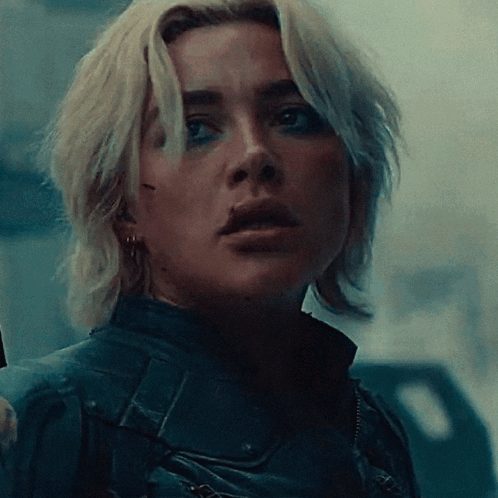 Close Up Of Woman's Face In Dark Room GIF