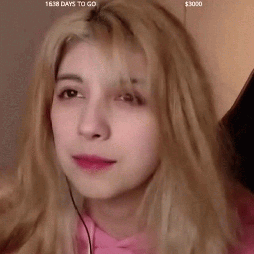Close Up Of Woman's Face In Pink Shirt GIF