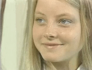 Close Up of Woman's Face with Blonde Hair and Blue Eyes