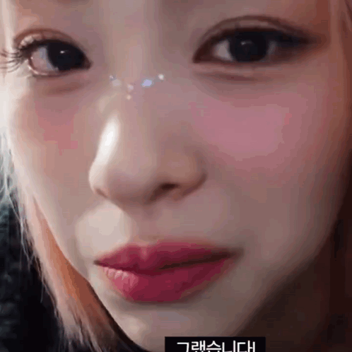 Close Up Of Woman's Face With Chinese Writing GIF