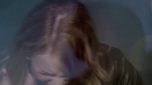 Close Up of Woman's Face With Hair Flying in Wind