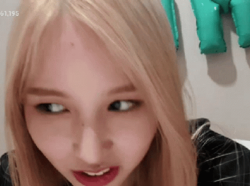 Close Up Of Woman's Face With Number 61195 GIF
