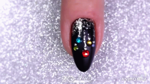 Close Up Of Woman's Nails With Rhinestones GIF