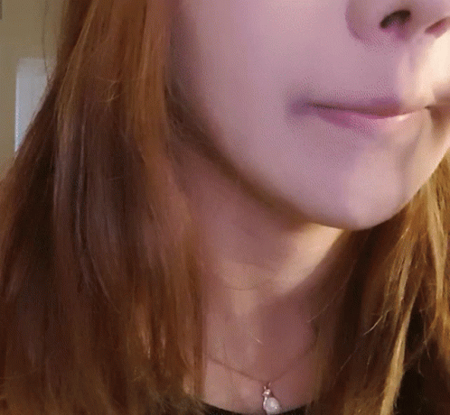 Close Up Of Woman Wearing Necklace GIF