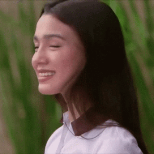 Close Up of Woman With Eyes Closed Smiling