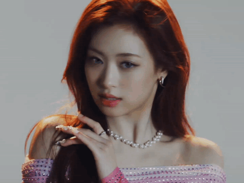 Close Up of Woman with Pearl Necklace and Earrings
