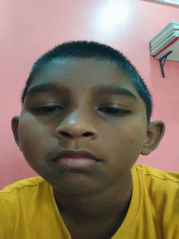 Close Up of Young Boy's Face on Pink Background