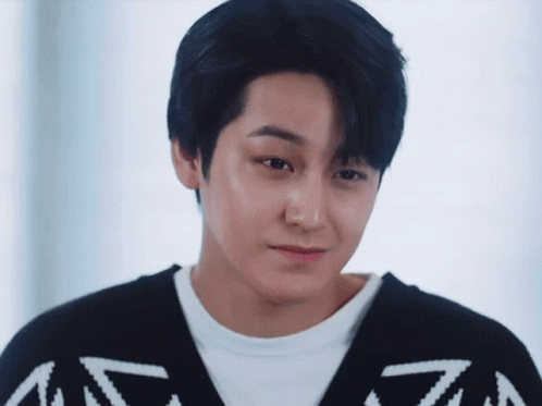 Close Up of Young Man in Black and White Sweater