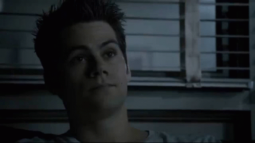 Close Up of Young Man's Face in Front of Window With Blinds