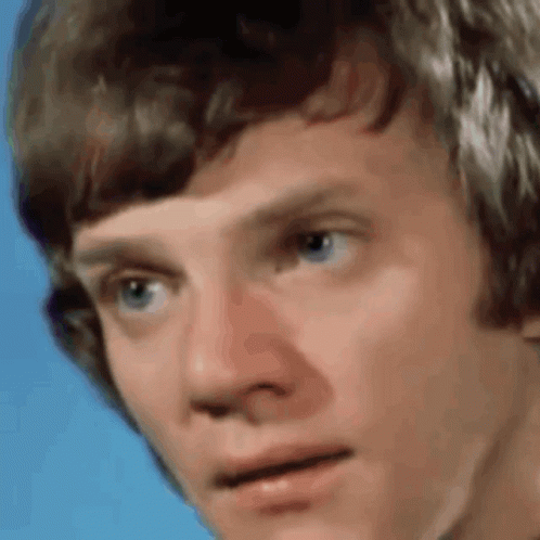 Close Up of Young Man's Face on Blue Background