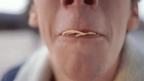 Close Up Person Eating Potato Chips With Mouth Open