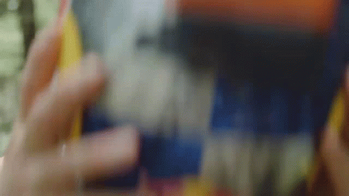 Close Up Person Holding Bottle of Soda