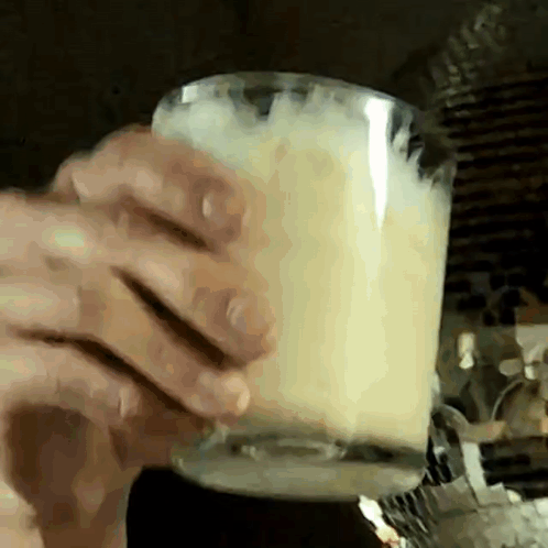 Close Up Person Holding Cup Of Milk GIF