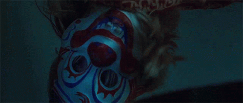 Close Up Person in Clown Mask in Dark