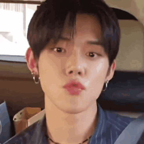 Close Up Person With Mouth Open And Earrings GIF