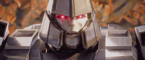 Close Up Robot With Red Eyes Looking at Camera