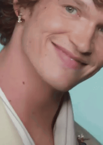 Close Up Smiling Man With Earrings