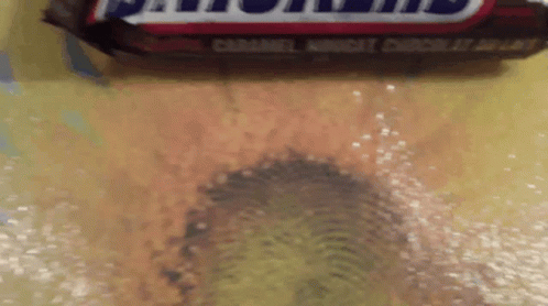 Close Up Snickers Bar Yellow Surface