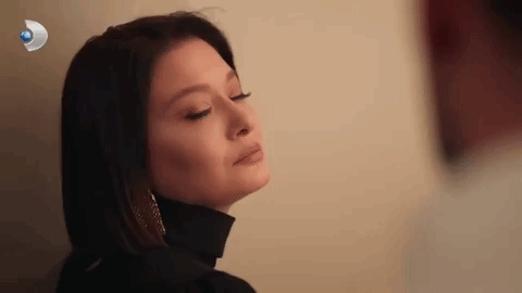 Close-Up Woman Eyes Closed Black Turtleneck Earrings