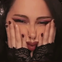 Close Up Woman Making Face With Hands on Face