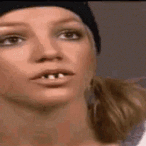 Close-Up Woman Missing Teeth In Beanie GIF