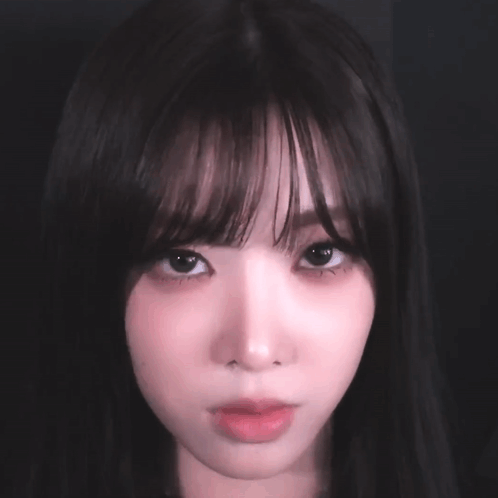 Close Up Woman's Face With Dark Hair GIF